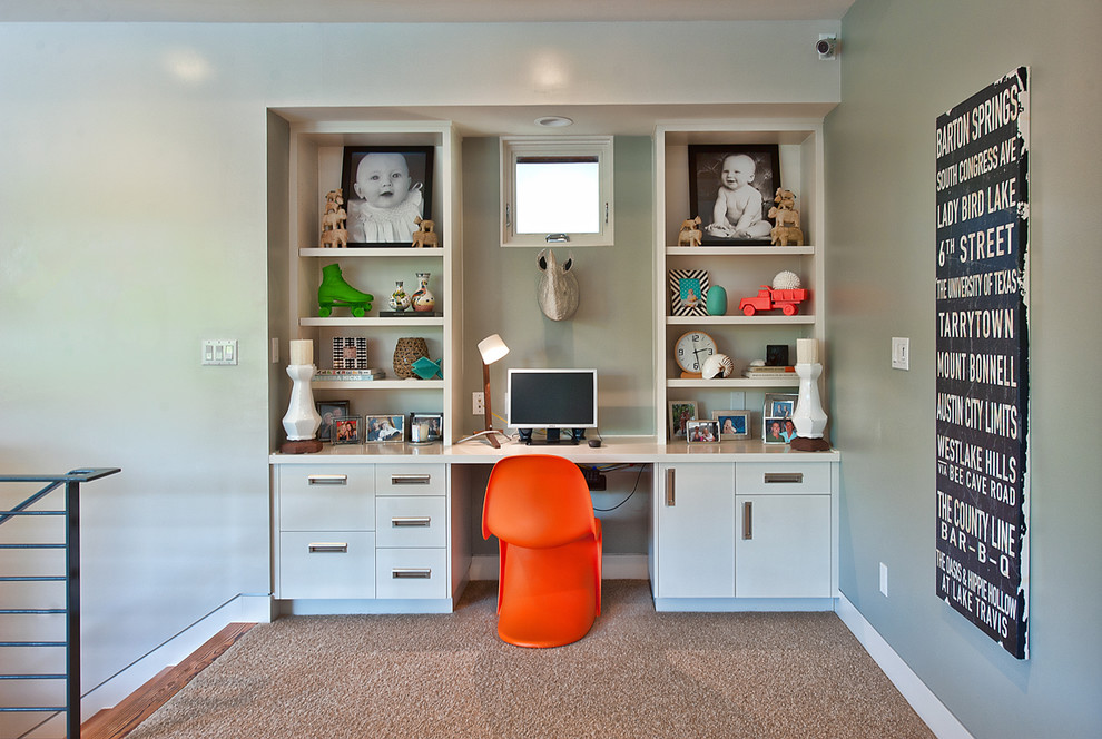 Inspiration for a contemporary gender neutral kids' study space in Austin with grey walls and carpet.