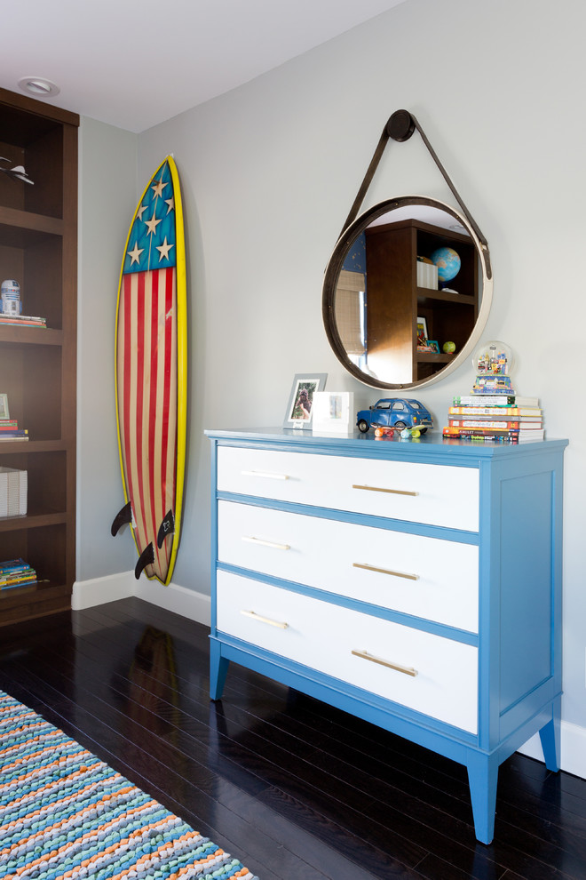 Example of a mid-sized transitional boy dark wood floor kids' room design in Los Angeles with gray walls