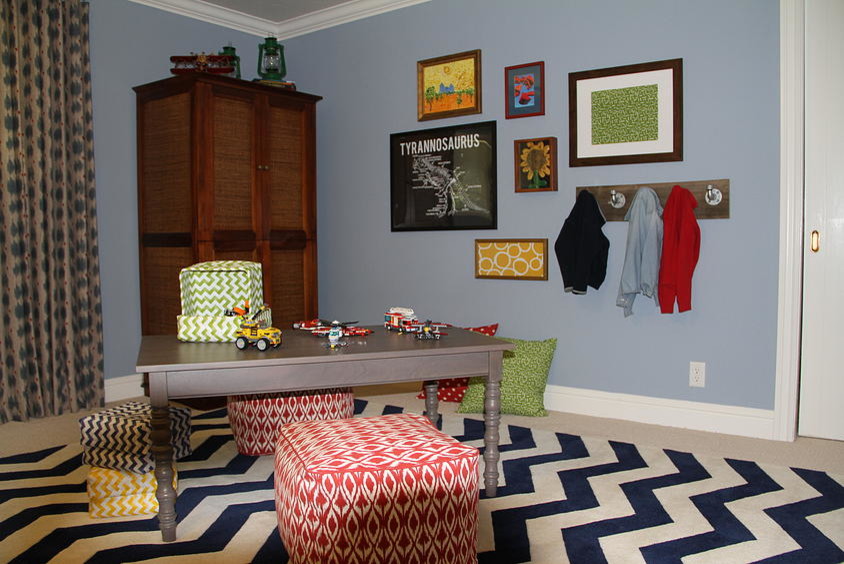 Inspiration for a large eclectic children’s room for boys in Other with blue walls and carpet.