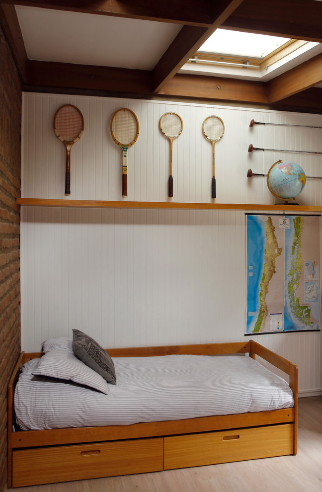 Trendy gender-neutral light wood floor kids' room photo in Other with white walls