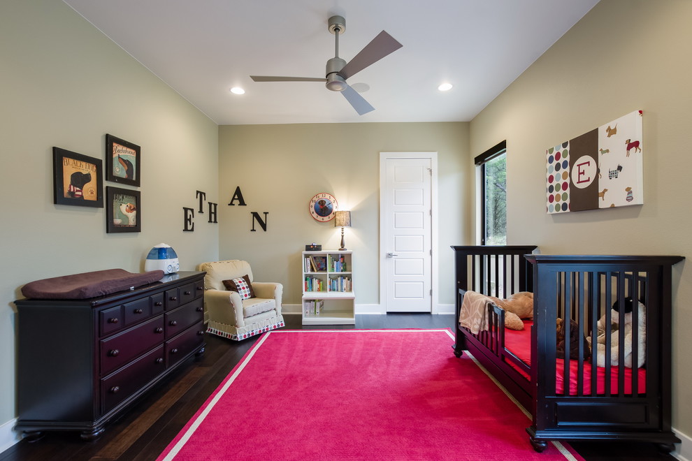 Photo of a modern children’s room for boys in Austin with beige walls and dark hardwood flooring.