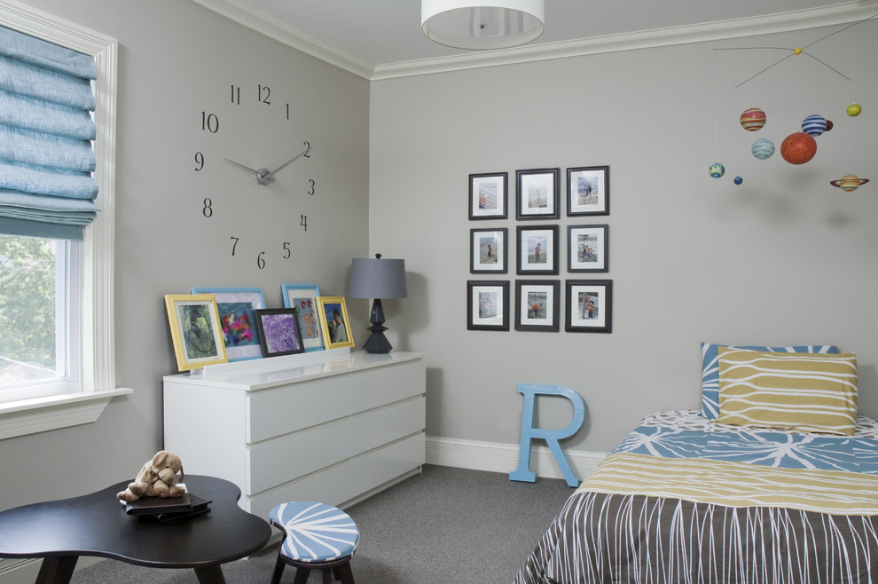 Trendy gender-neutral carpeted kids' room photo in Chicago with gray walls