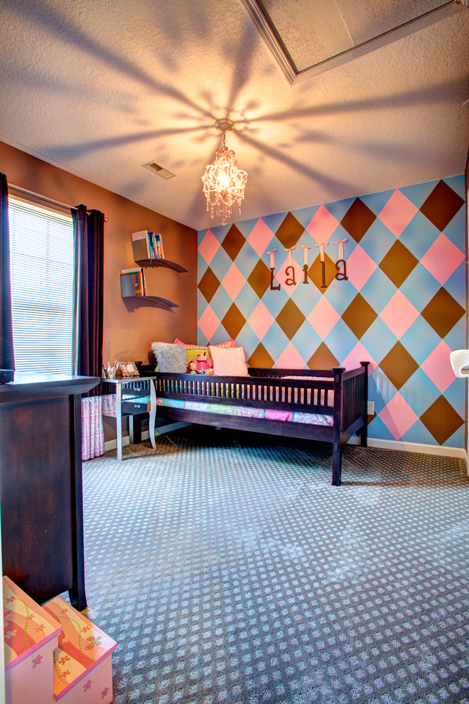 Example of a large transitional girl carpeted kids' room design in Other with multicolored walls