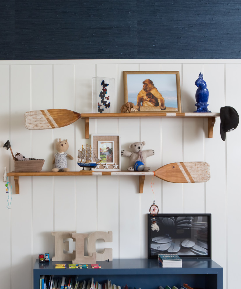 Kids' room - mid-sized traditional boy carpeted kids' room idea in Los Angeles with blue walls