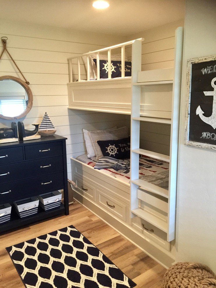 Design ideas for a nautical kids' bedroom in Portland with white walls and light hardwood flooring.
