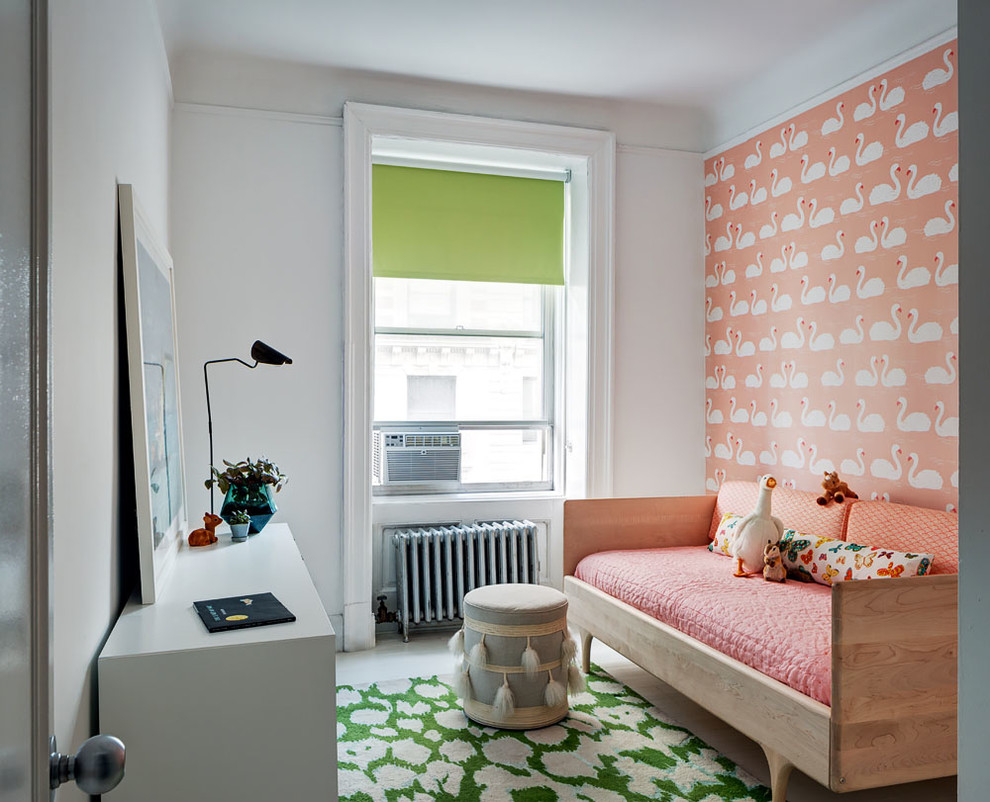 Inspiration for a classic kids' bedroom in New York with pink walls, painted wood flooring and white floors.