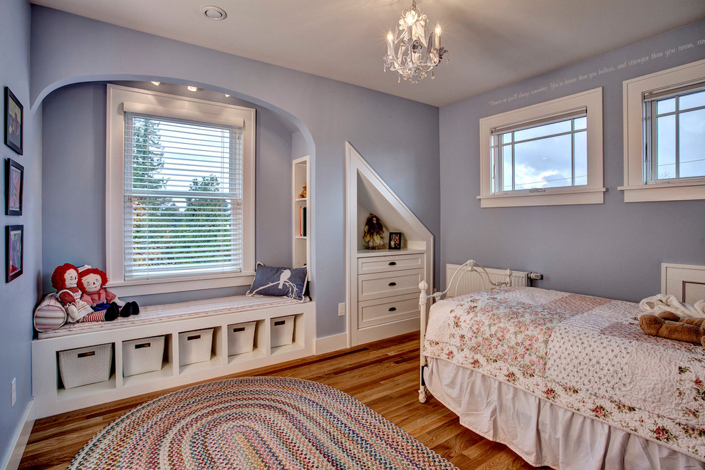 Inspiration for a medium sized traditional children’s room for girls in Seattle with blue walls and medium hardwood flooring.