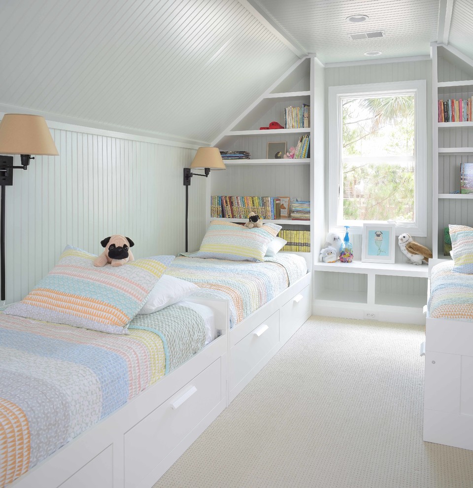 Coastal children’s room for girls in Charleston with white walls, carpet and feature lighting.