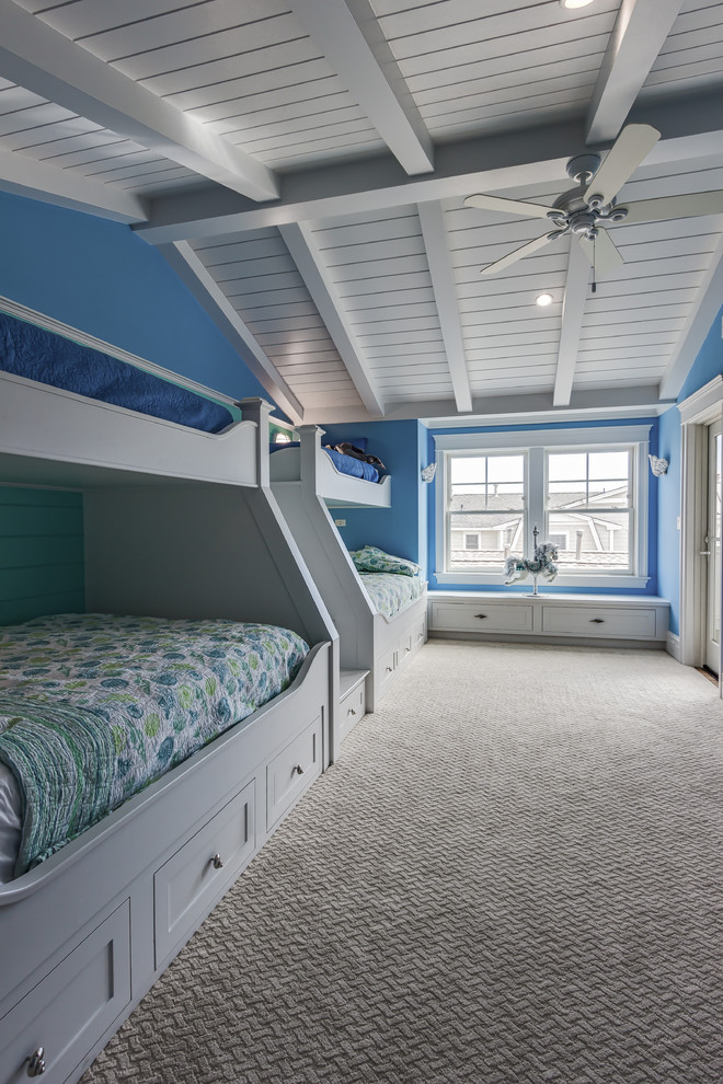 Esempio di una grande cameretta per bambini stile marino con pareti blu e moquette