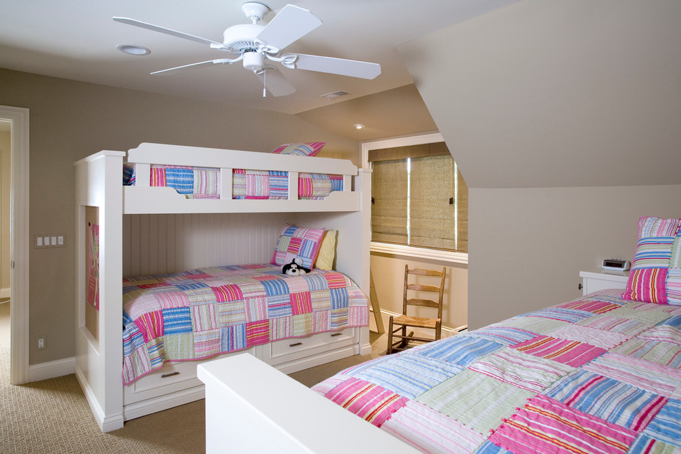 This is an example of a medium sized classic gender neutral children’s room in Chicago with beige walls and carpet.