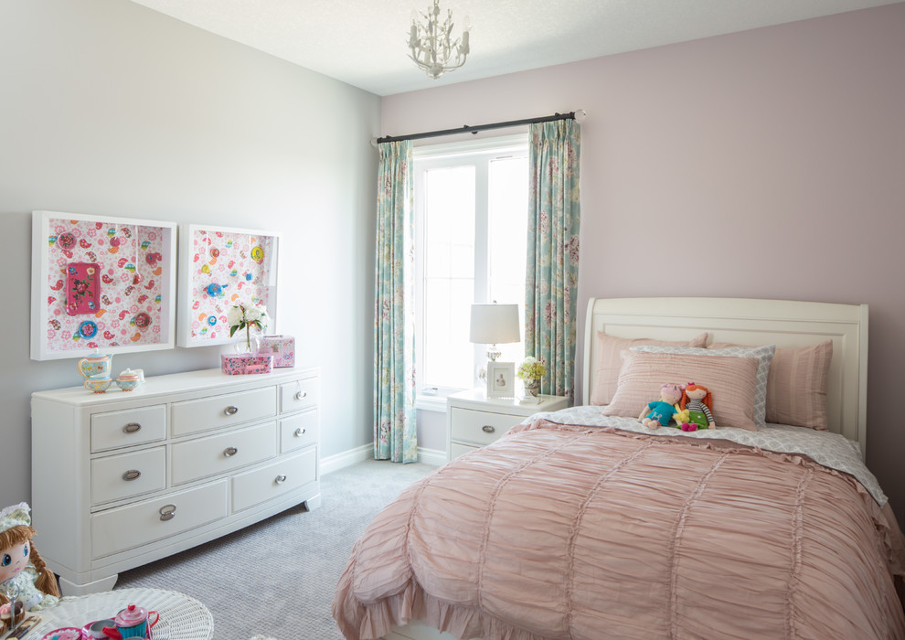 Example of a large transitional girl carpeted kids' room design in Calgary with pink walls