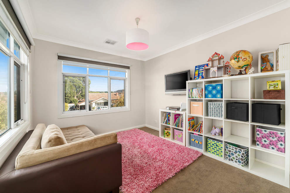 Design ideas for a medium sized victorian playroom in Melbourne with beige walls, carpet and brown floors.