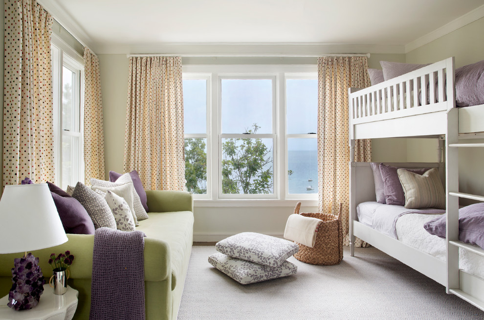 Beach style children’s room for girls in Boston with beige walls, carpet and beige floors.