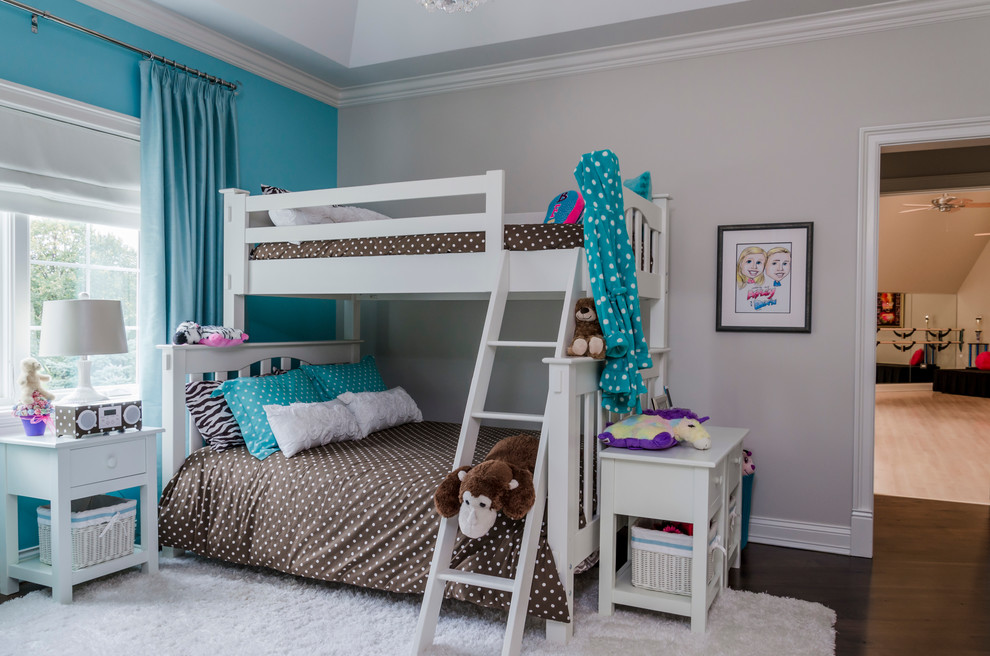 Photo of a medium sized traditional children’s room for girls in Chicago with grey walls and medium hardwood flooring.