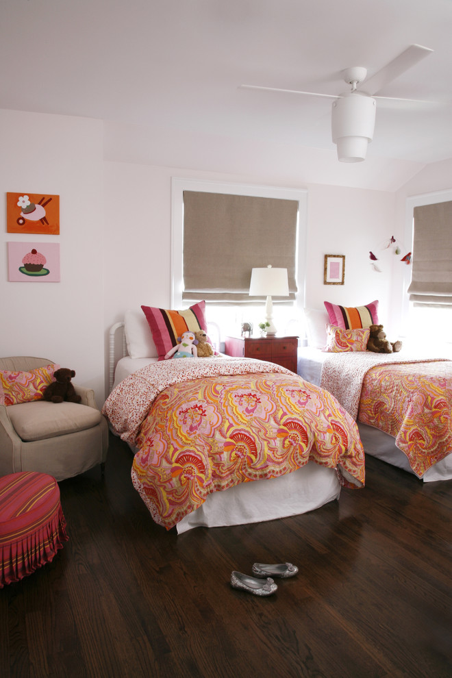 Design ideas for a classic children’s room for girls in Chicago with white walls, dark hardwood flooring and brown floors.