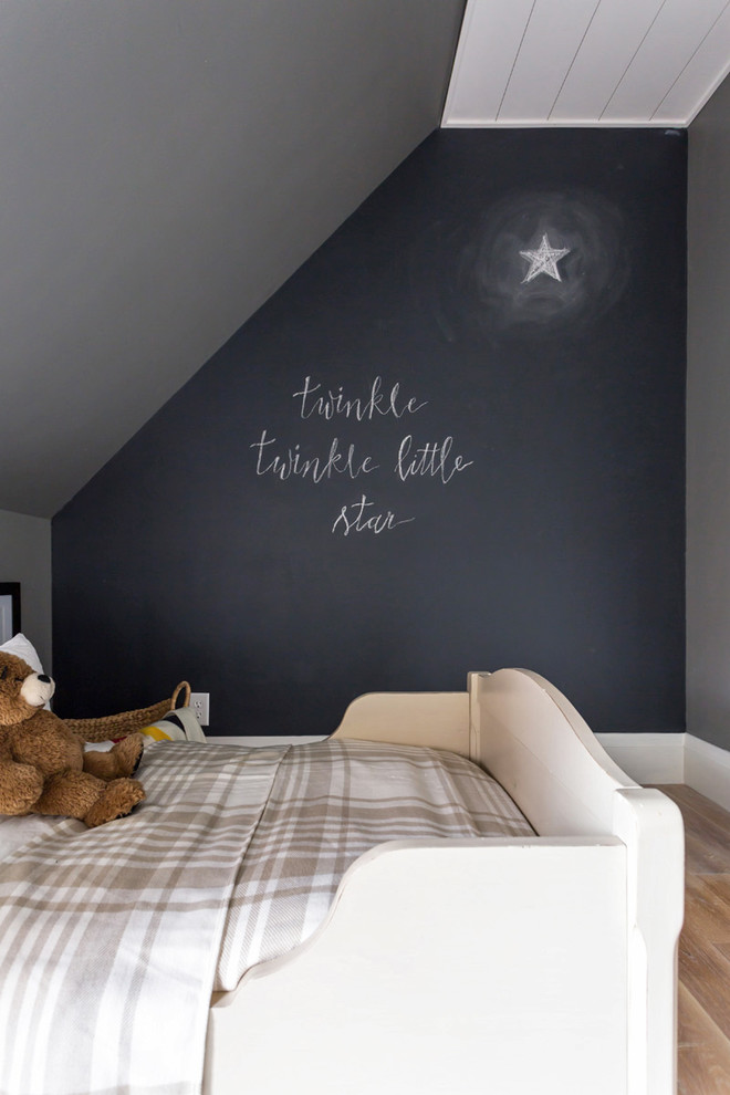 Medium sized rural children’s room for boys in Toronto with grey walls, light hardwood flooring and beige floors.