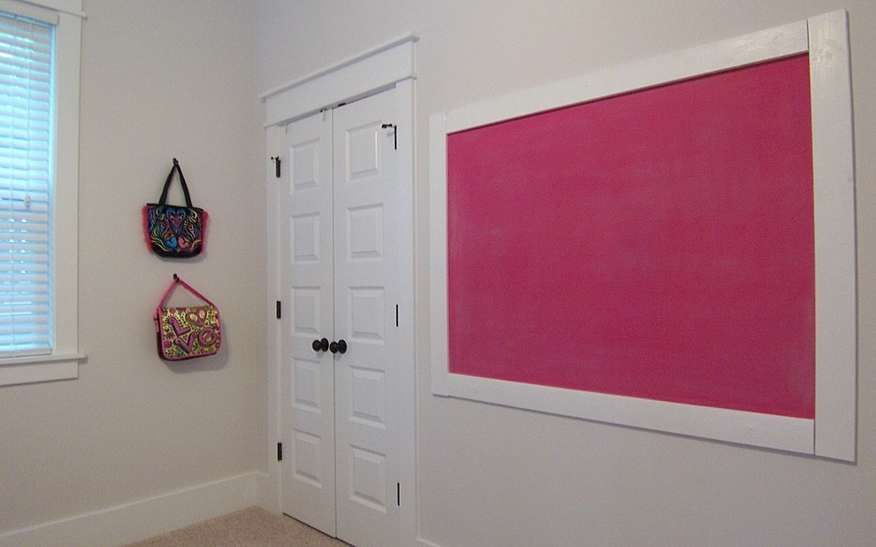 This is an example of a traditional teen’s room for girls in Raleigh with white walls, carpet and beige floors.