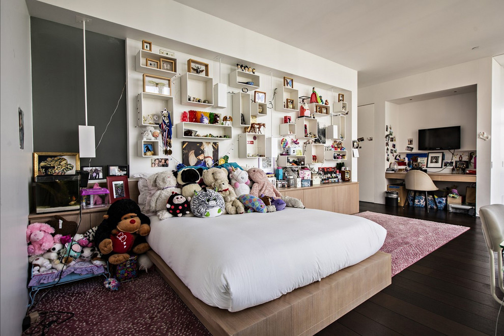 Large minimalist girl dark wood floor and brown floor kids' room photo in New York with white walls