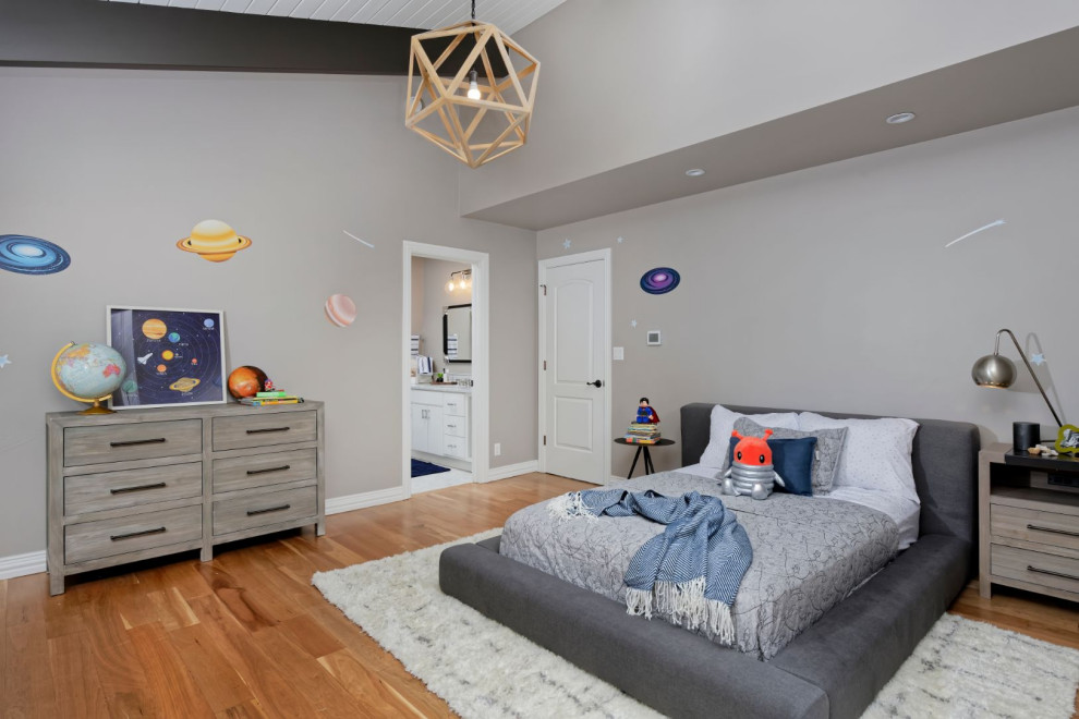 Inspiration for a medium sized contemporary kids' bedroom for boys in Denver with beige walls and medium hardwood flooring.