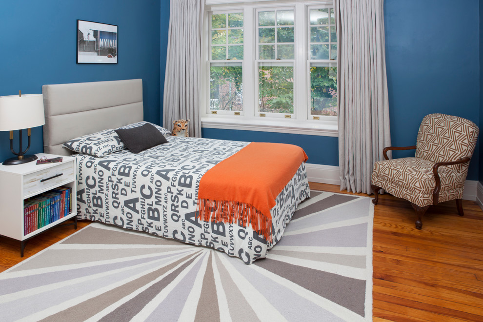 Inspiration for a large classic teen’s room for boys in Philadelphia with blue walls and light hardwood flooring.