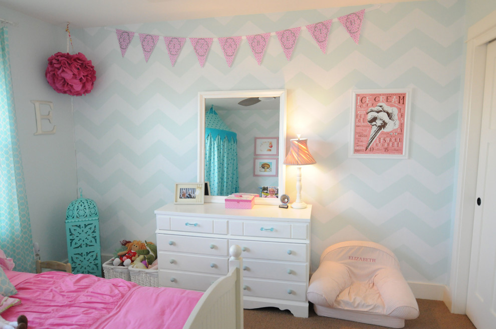Example of a minimalist girl childrens' room design in New York with blue walls