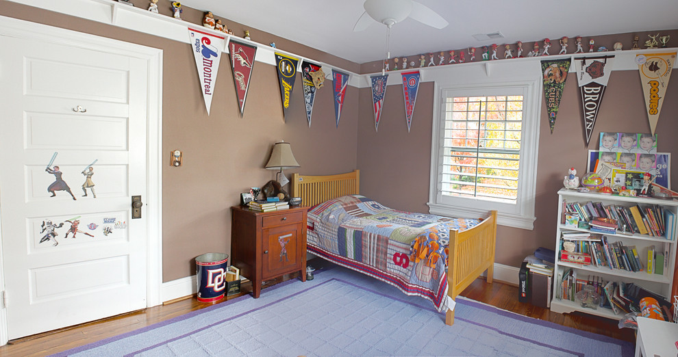 Design ideas for a medium sized children’s room for boys in DC Metro with brown walls and medium hardwood flooring.