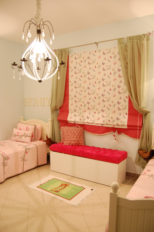 Photo of a retro children’s room for girls in Other with blue walls and ceramic flooring.