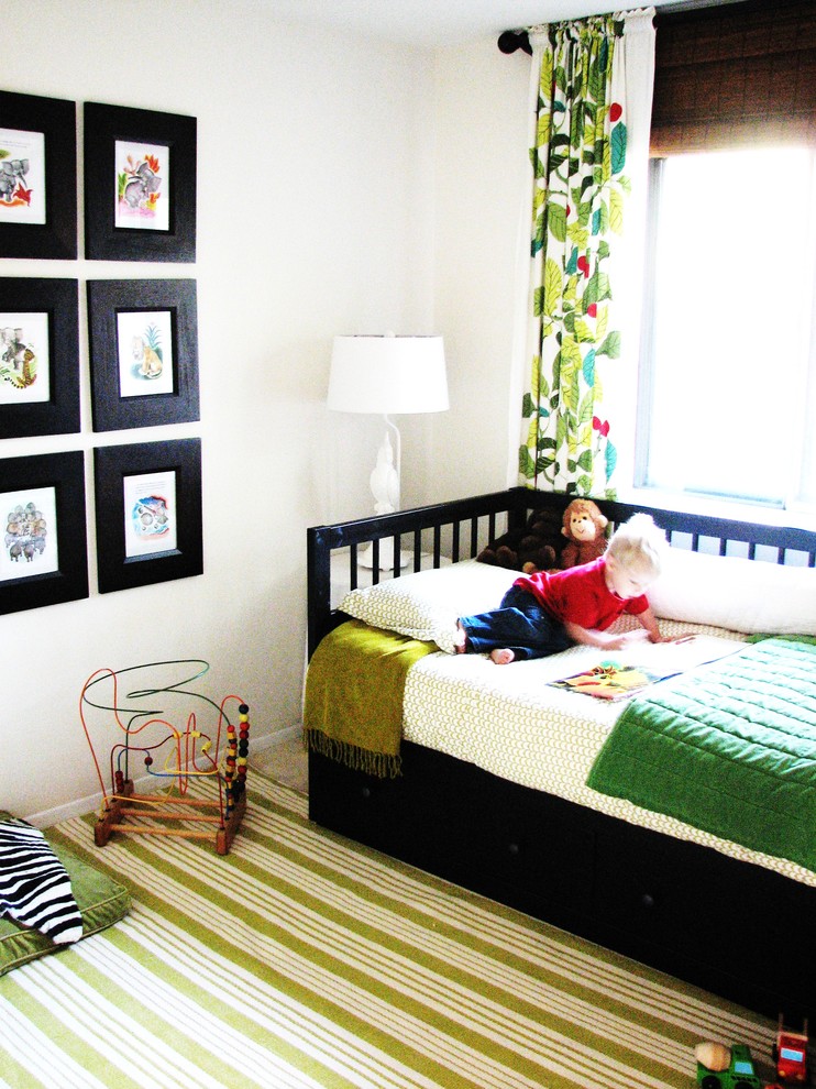 Design ideas for an eclectic gender neutral toddler’s room in DC Metro with white walls and carpet.