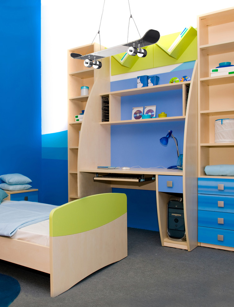 Inspiration for a mid-sized transitional boy carpeted kids' room remodel in New York with blue walls