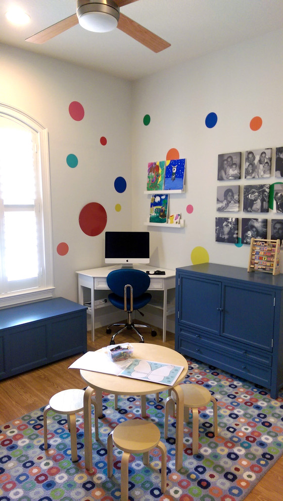 Medium sized contemporary gender neutral kids' bedroom in Orlando with grey walls and light hardwood flooring.