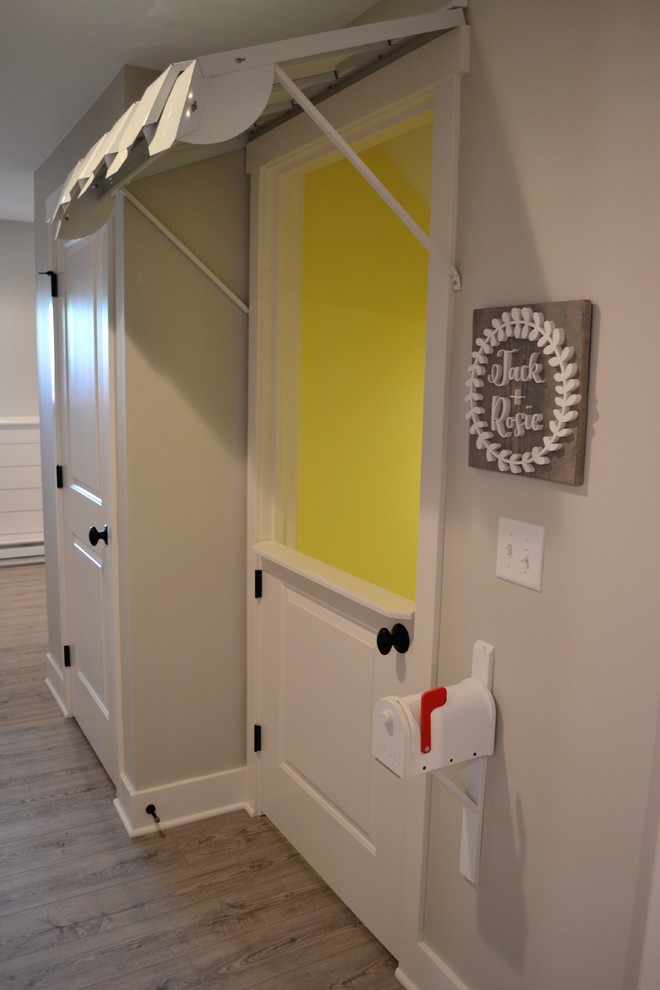 Example of a small eclectic gender-neutral carpeted and gray floor playroom design in Detroit with yellow walls