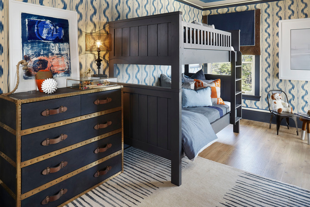 This is an example of a traditional kids' bedroom for boys in San Diego with multi-coloured walls and medium hardwood flooring.