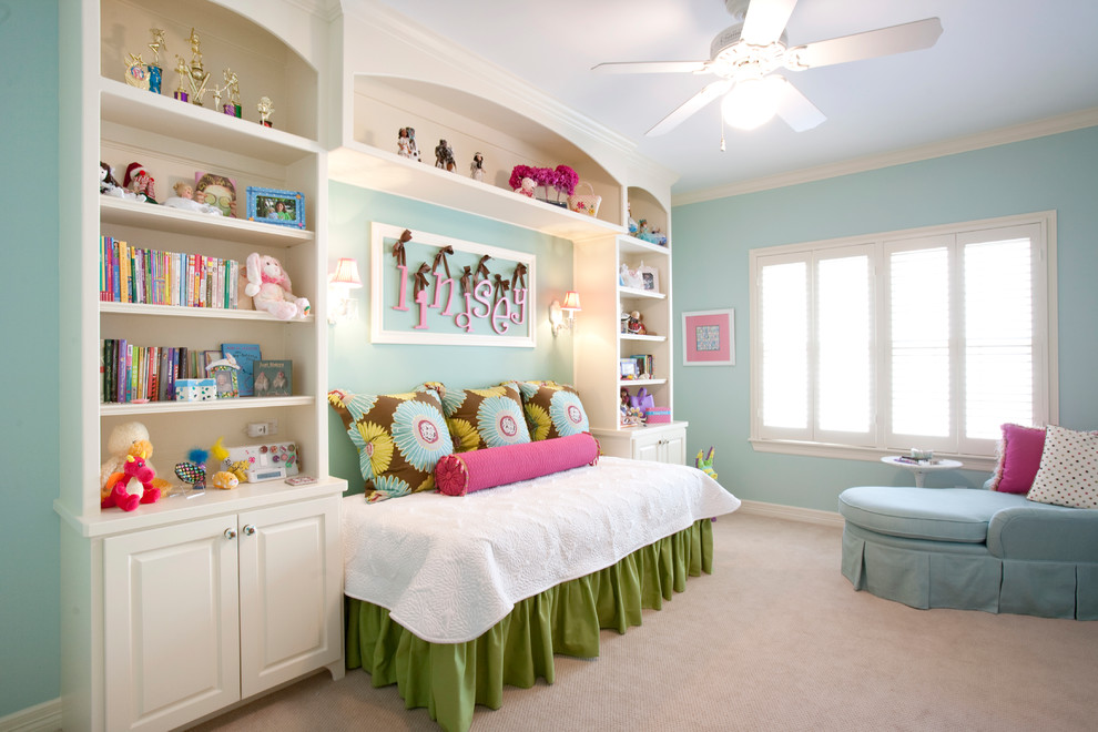 Example of a large classic girl carpeted kids' room design in Houston with blue walls