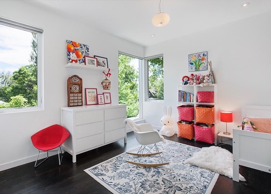 Inspiration for a mid-sized contemporary girl dark wood floor kids' room remodel in Denver with white walls