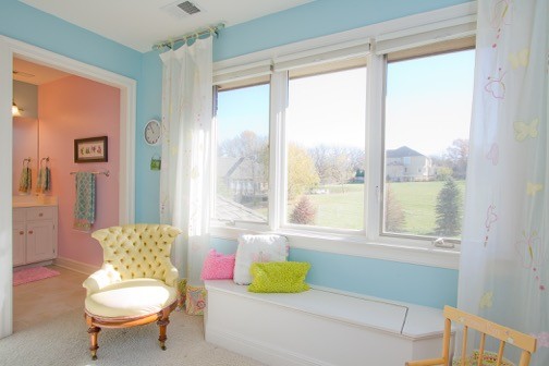 Large transitional girl carpeted and beige floor kids' room photo in Kansas City with blue walls