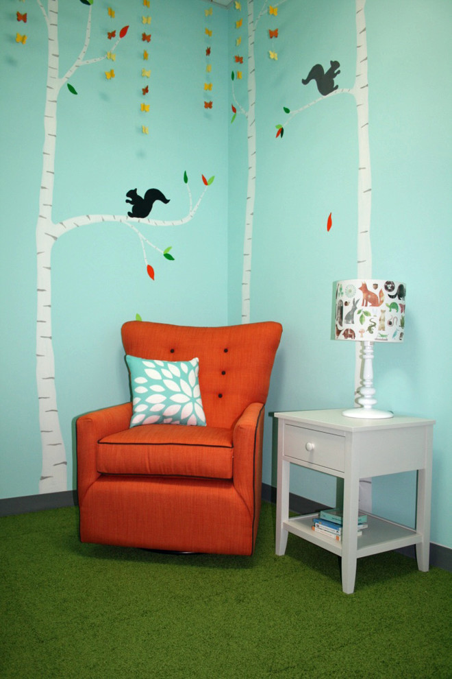 Inspiration for a small modern gender neutral kids' bedroom in New York with blue walls and carpet.