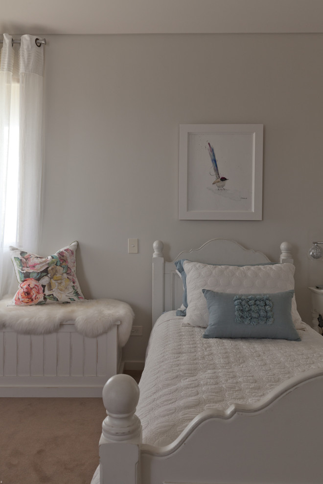 Photo of a shabby-chic style children’s room for girls in Perth with white walls and carpet.