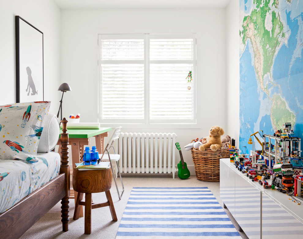 Contemporary gender neutral children’s room in Toronto with carpet and white walls.