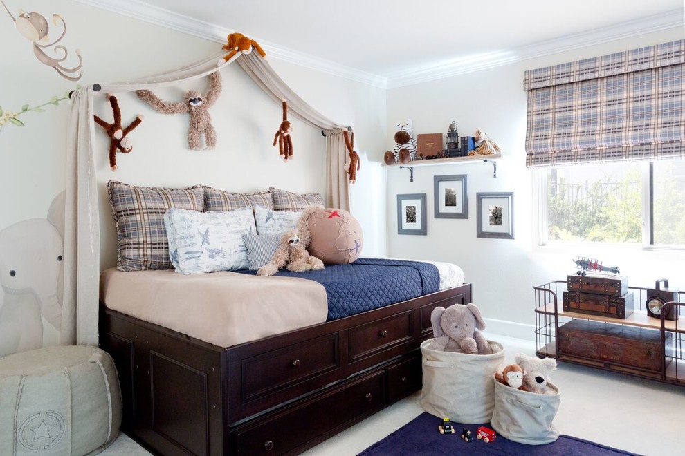 Classic children’s room for boys in Los Angeles with beige walls, carpet and beige floors.