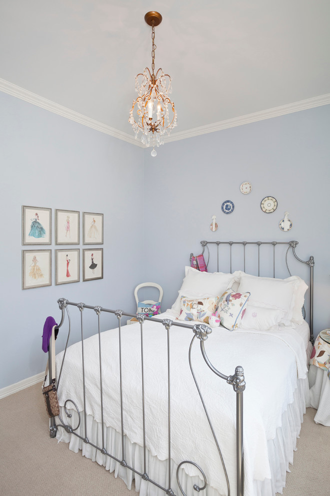 Example of a classic girl carpeted kids' room design in Austin with blue walls