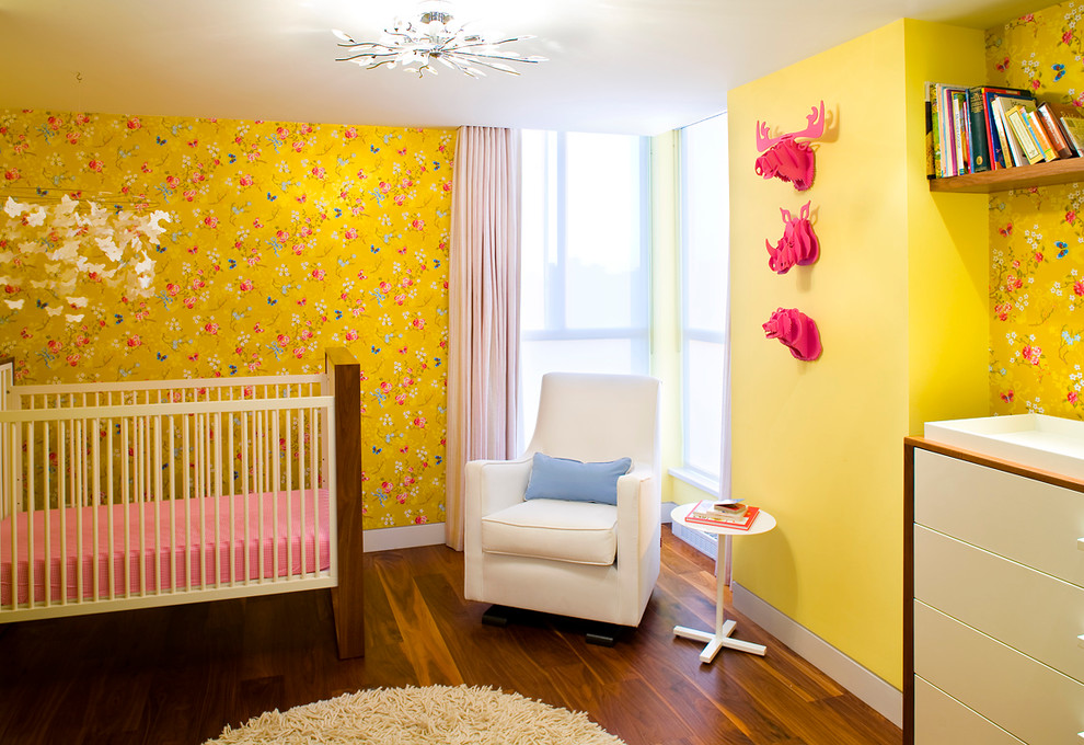 Design ideas for a large contemporary kids' bedroom for girls in Vancouver with medium hardwood flooring and multi-coloured walls.