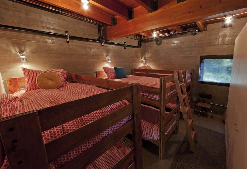 Ejemplo de dormitorio infantil minimalista extra grande con suelo de cemento