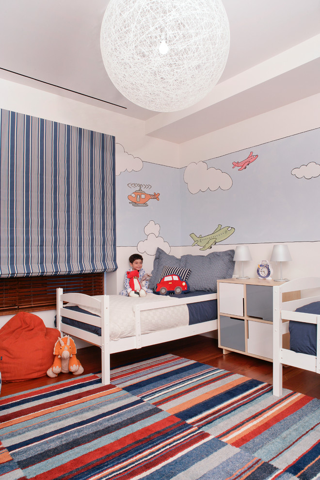 Идея дизайна: детская среднего размера в современном стиле с спальным местом, разноцветными стенами и паркетным полом среднего тона для мальчика