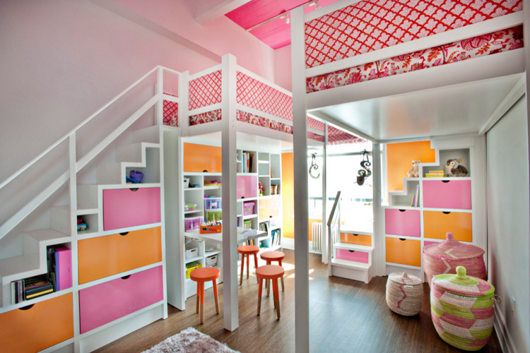 Design ideas for a medium sized eclectic children’s room for girls in New York with white walls and medium hardwood flooring.