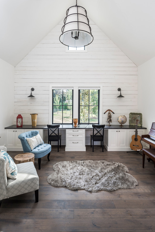 Design ideas for a large rural gender neutral kids' study space in Vancouver with white walls, dark hardwood flooring and brown floors.