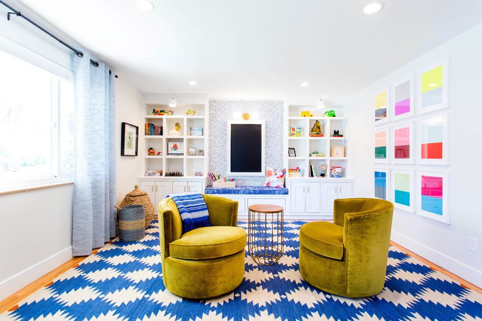 Photo of a contemporary gender neutral playroom in Austin with white walls.