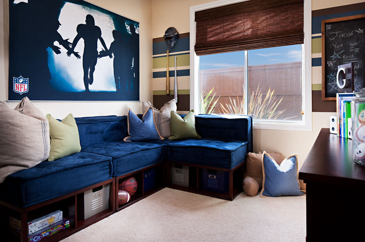 Mid-sized trendy boy carpeted kids' room photo in San Diego with multicolored walls