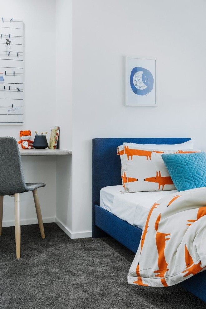 Inspiration for a small contemporary children’s room for boys in Townsville with white walls, carpet and grey floors.