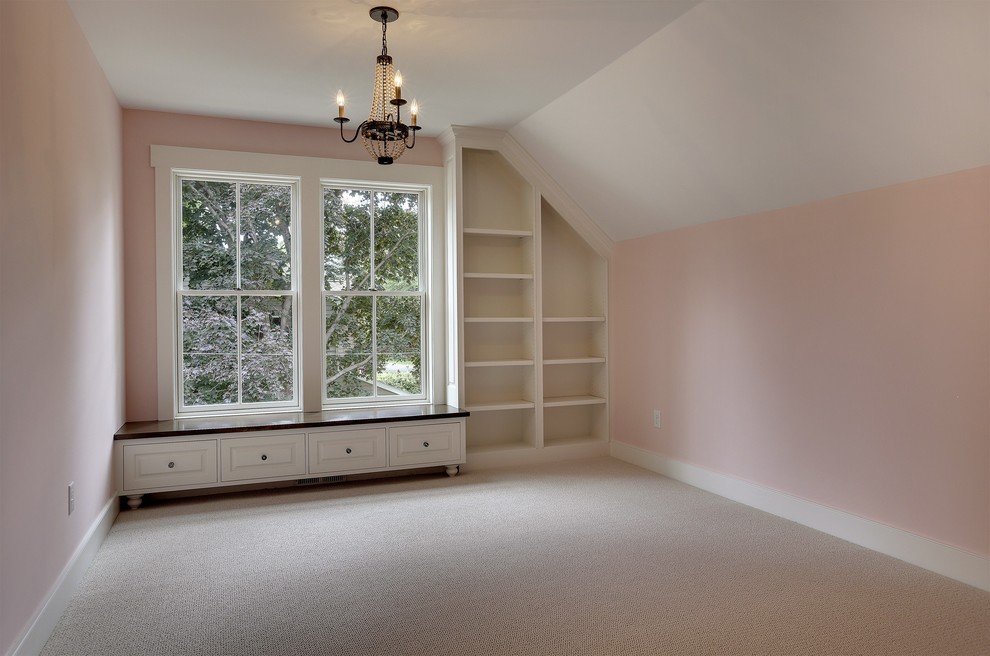 Medium sized traditional children’s room for girls in Minneapolis with pink walls.