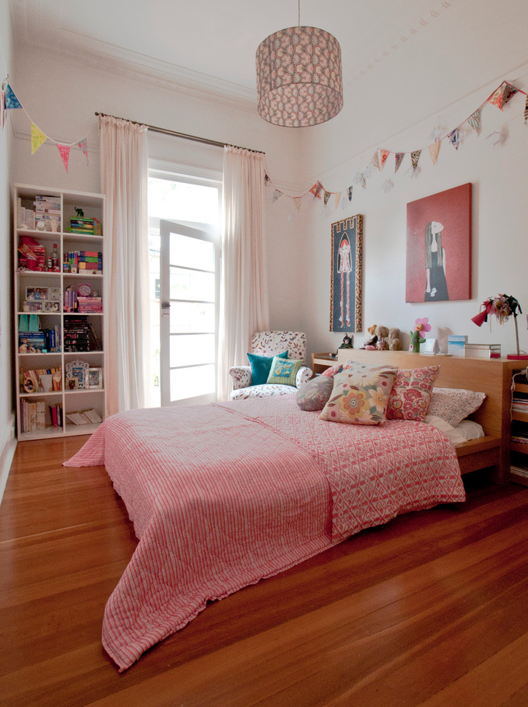 Medium sized bohemian kids' bedroom for girls in Perth with white walls and medium hardwood flooring.